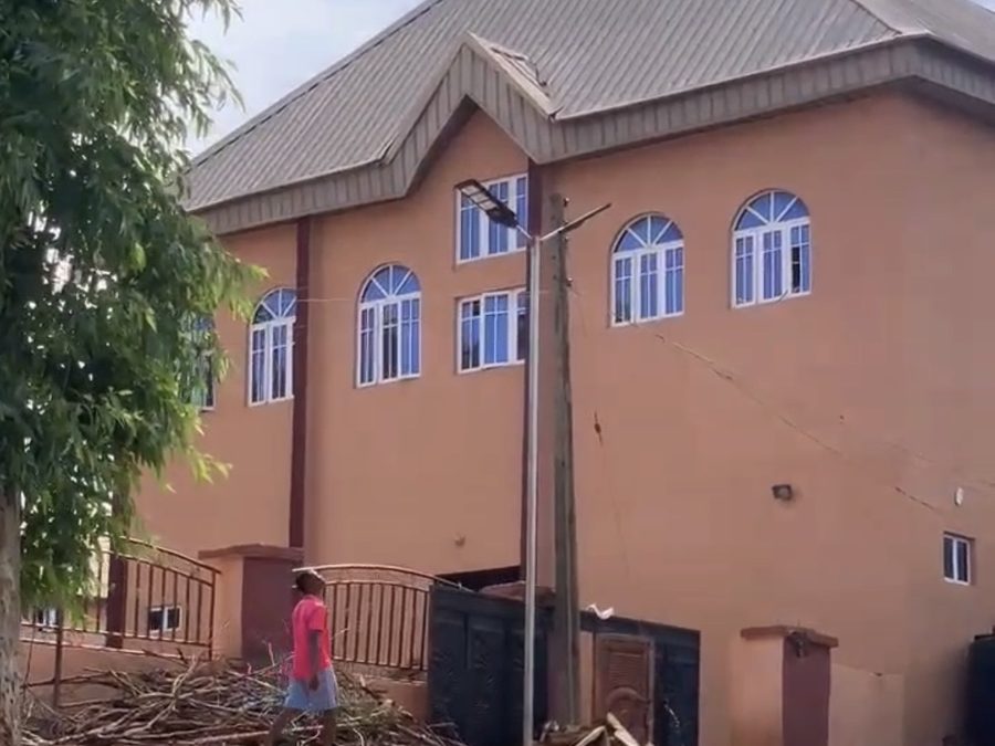 Newly installed solar street light beside a seminary building